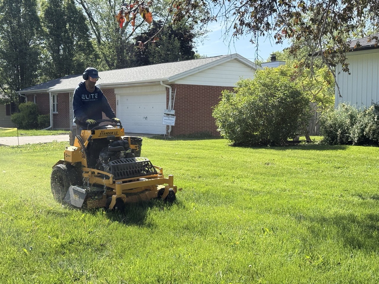 Professional lawn mowing technician